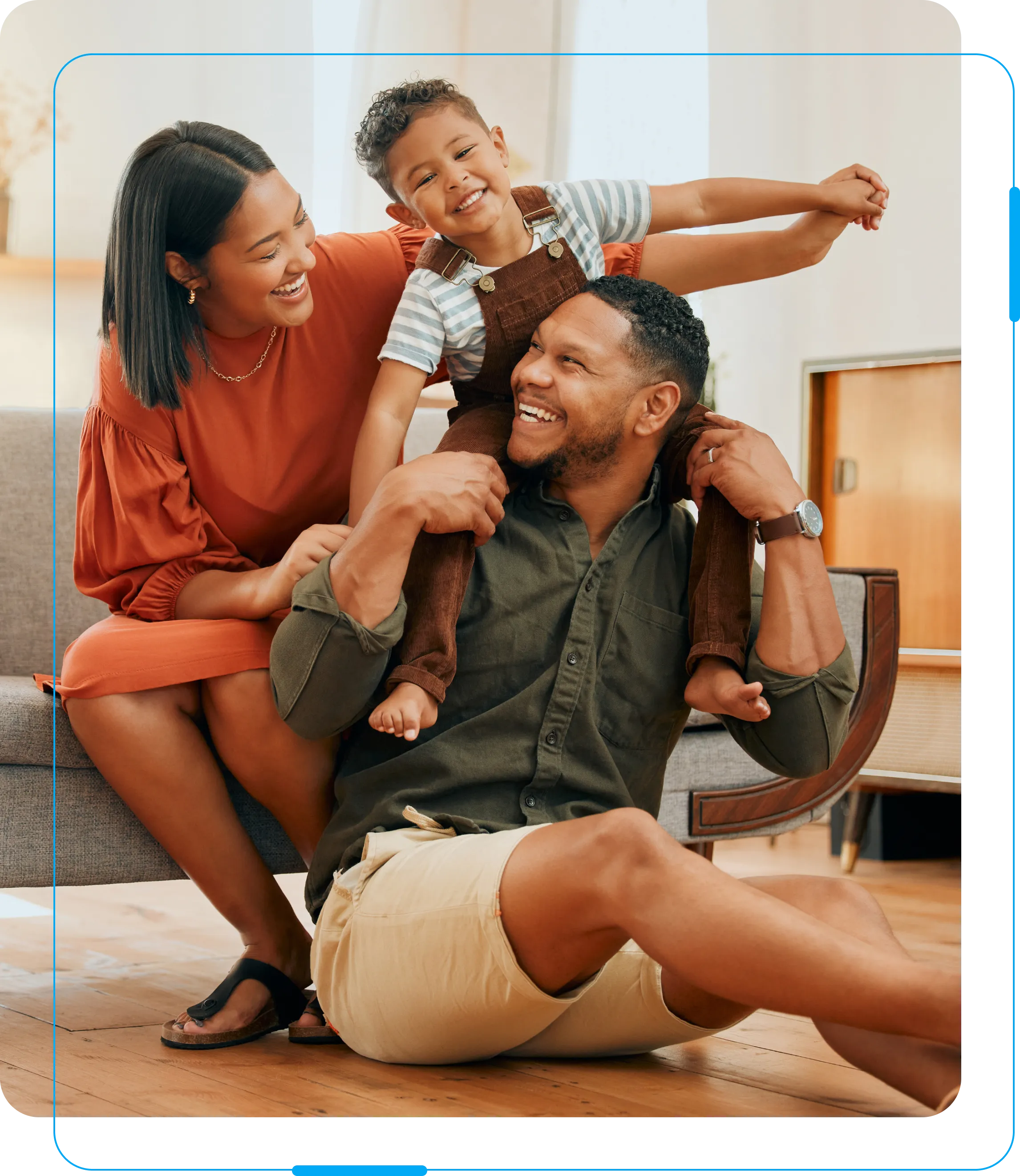 Happy family with young child playing.